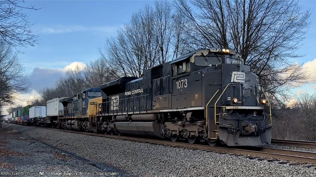 NS 1073 leads 28M east.